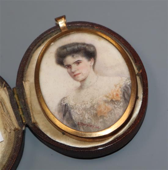 An Edwardian gilt framed oval oil on ivory miniature, portrait of a lady, cased